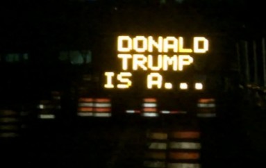 Somebody keeps hacking these Dallas road signs with messages about Donald Trump, Bernie Sanders and Harambe the gorilla